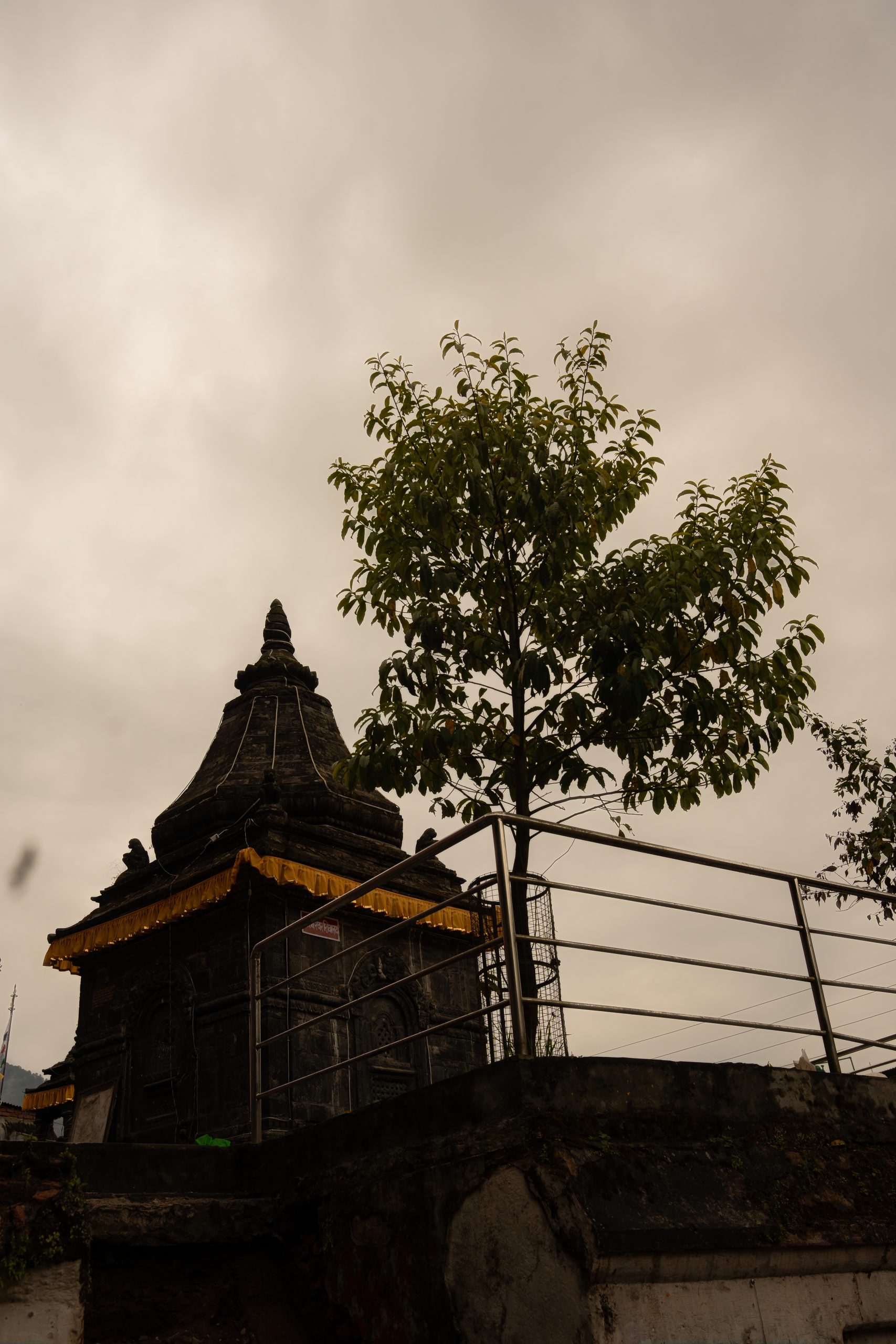 Godawari Temple with red and gold pagoda-style roofs