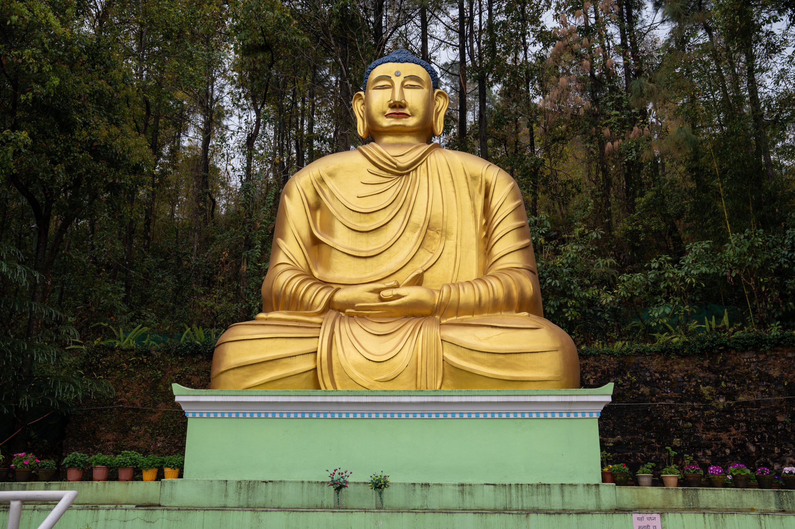 25-foot golden Buddha statue in a meditative pose at Shantiban